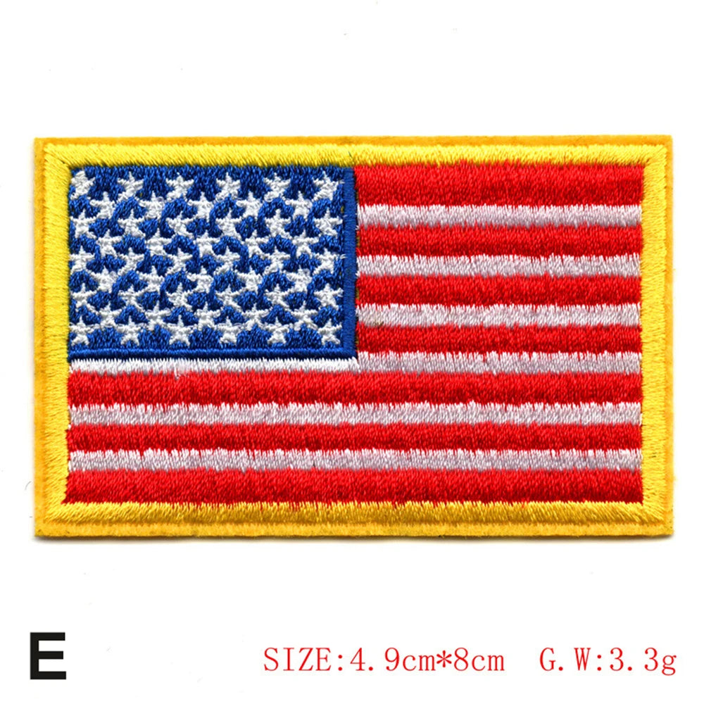 Embroidered American flag patch featuring red, white, and blue stripes and stars on a yellow fabric background