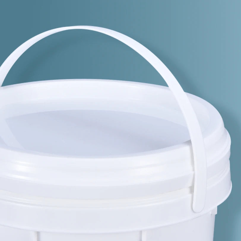 A white plastic storage bucket with a clear lid and a handle is shown against a blue background.