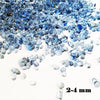 A pile of small, translucent blue decorative stone pebbles for terrariums and aquariums.