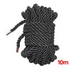 Black soft silk bondage rope coiled and bundled for couples roleplay