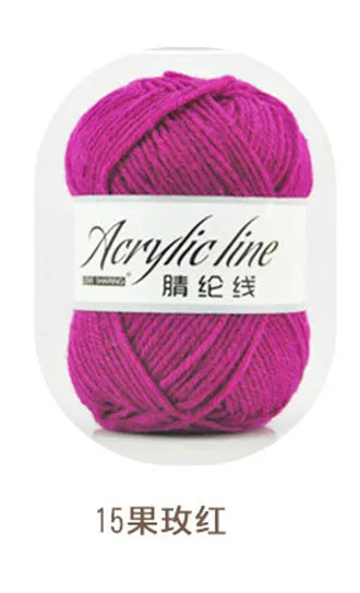 A ball of magenta acrylic yarn labeled as Acrylic line in 15-color pink.