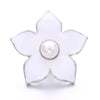 A white flower shaped metal snap button with a pearl center for jewelry making