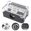 Clear plastic power distribution block for car audio, featuring four terminals and a fuse holder.