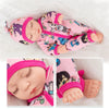 A pink jumpsuit outfit for a baby doll with a matching pink hat and accessories.