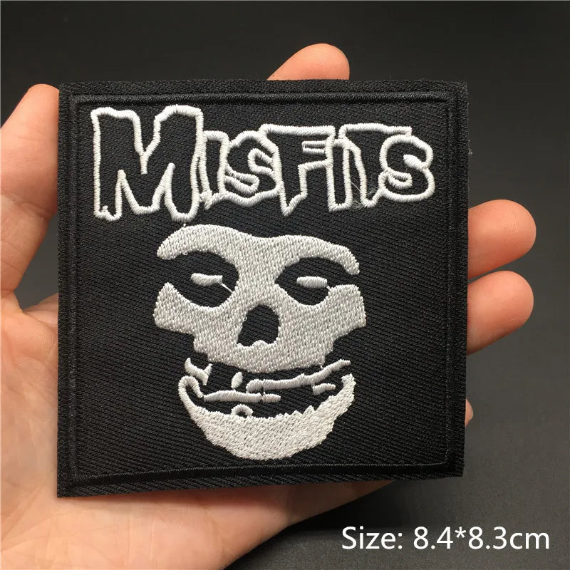 Black embroidered patch featuring a stylized skull and the text MISFIS in white thread.