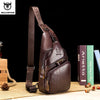 A brown genuine leather chest bag with a strap and zipper is displayed on a wooden surface.
