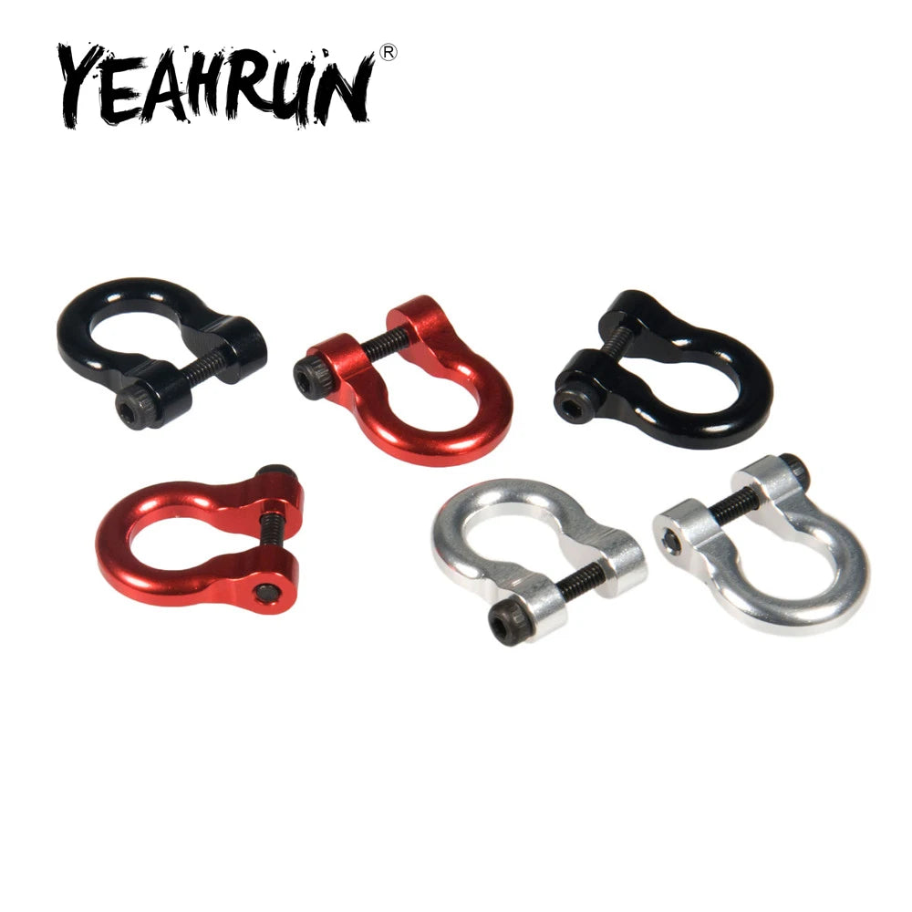 A set of two metal alloy tow shackles in red and silver colors for an RC crawler.