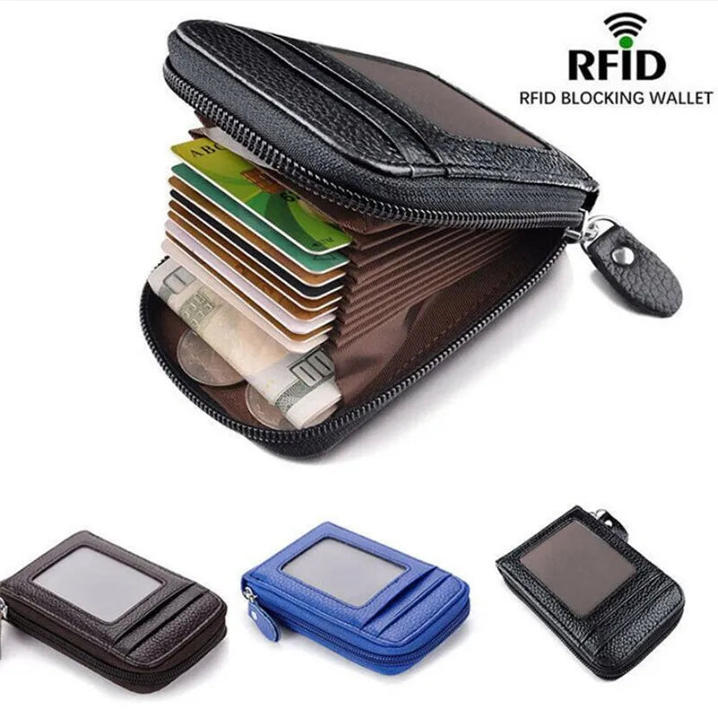 A collection of various cards and a black leather RFID blocking wallet with a silver card holder.