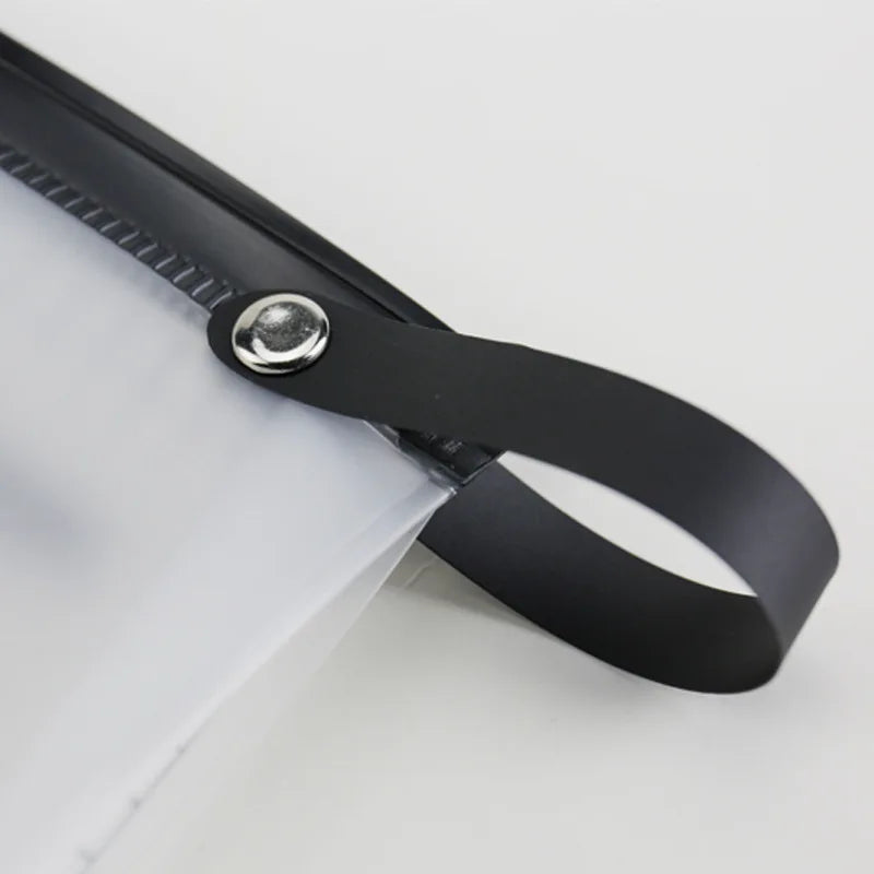 A black hanging hook attached to a clear toiletry bag.