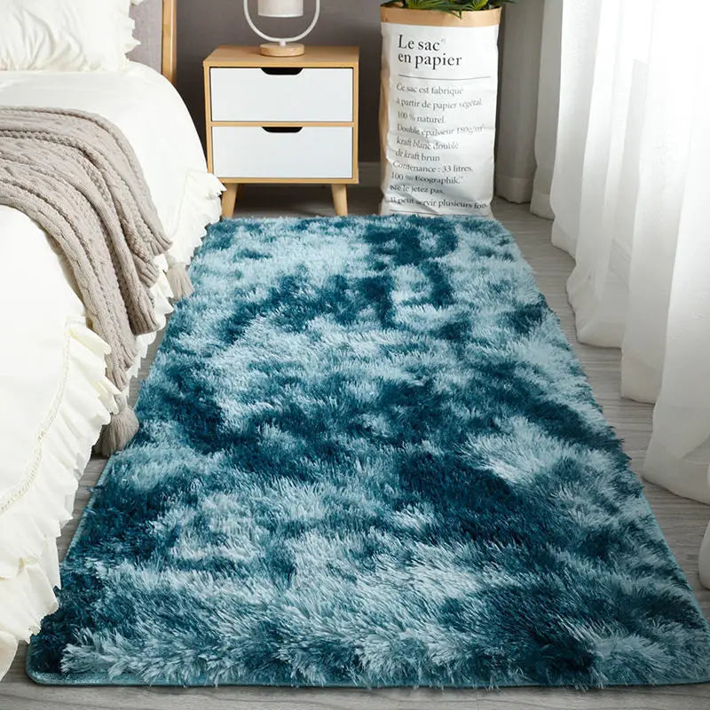A deep teal fluffy rug with a long, rectangular shape placed on a wooden floor.