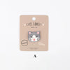 A light brown iron-on patch featuring an embroidered gray and white cat face.