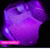 Pink purple RGB LED ambient light illuminating a car interior with a keyboard and surrounding leather upholstery