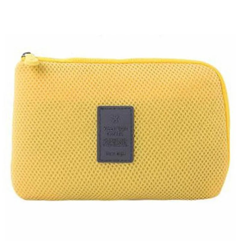 A yellow compact travel cable organizer bag with a dark gray rectangular insert.