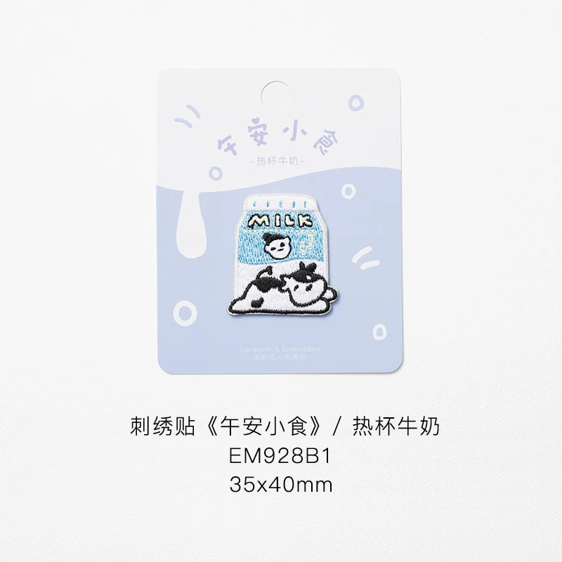 An embroidered iron-on patch featuring a cute cow design on a milk-themed background.