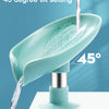 A teal leaf-shaped soap dish with a 45 degree tilt setting is shown dripping water.