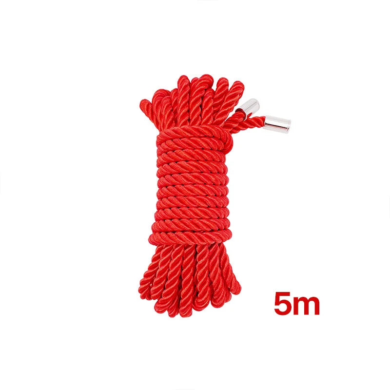 A bundle of bright red soft silk bondage rope, approximately 5 meters long.