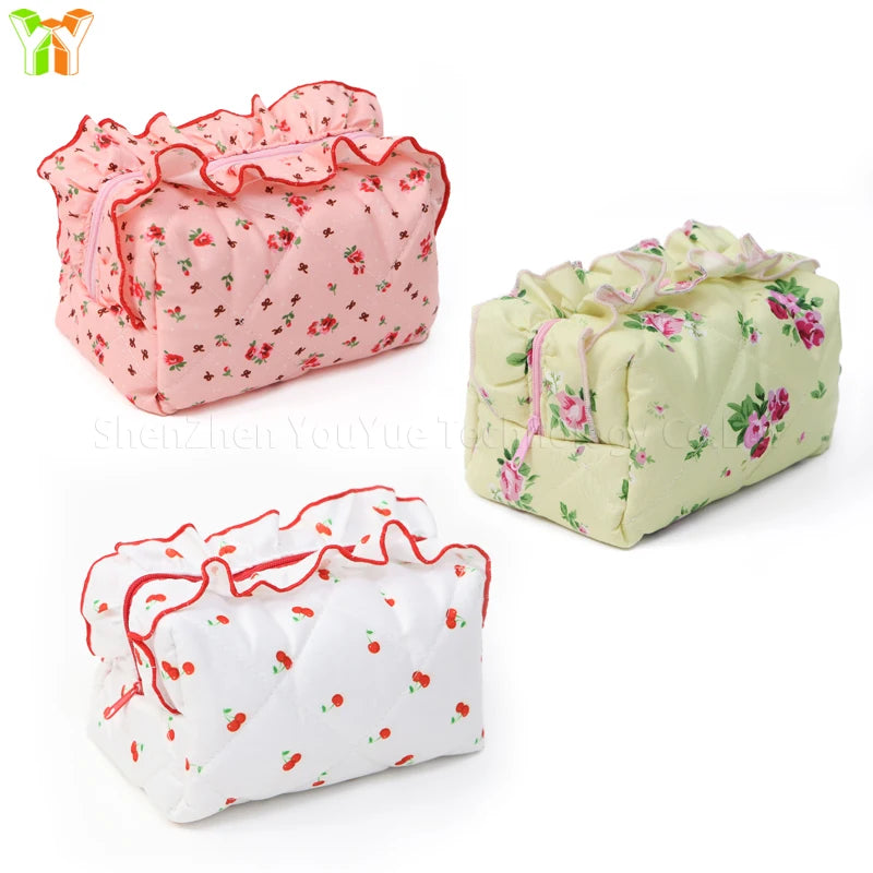 Neceser acolchado con estampado floral y lazo decorativo