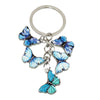 Silver butterfly keychain charm with blue and white iridescent wings