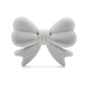 A white food-grade silicone bow or ribbon used for jewelry making and DIY crafts.