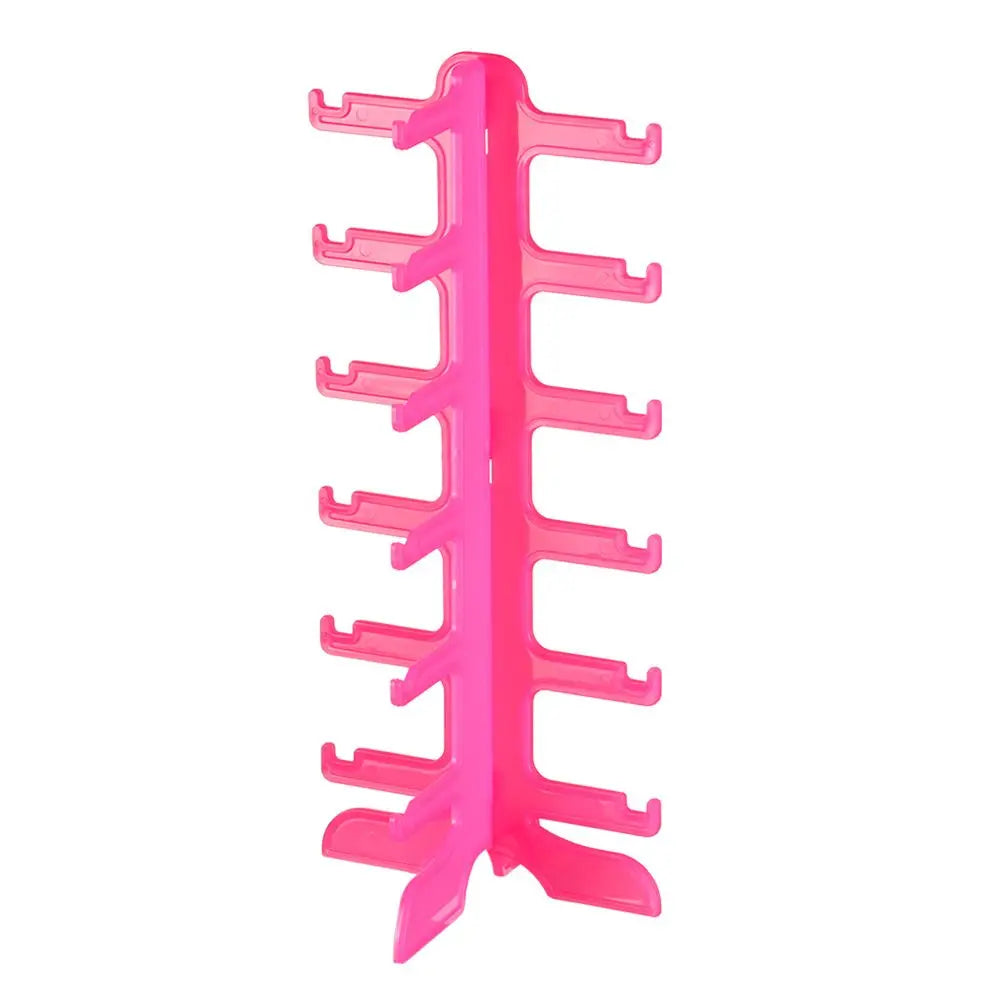 A pink stackable display stand designed for holding and organizing sunglasses and reading glasses.