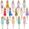 A collection of 12 female fashion dolls in various colorful outfits and accessories.