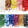 A collection of mixed glass seed beads in various colors including clear, amber, pink, purple, and red for jewelry making.