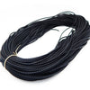 A spool of black braided leather cord for jewelry making with multiple widths.