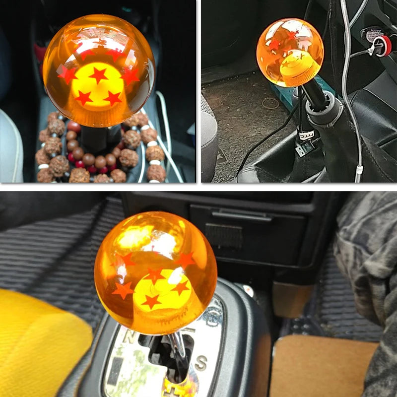 Close-up of an orange star design shift knob mounted in a vehicle interior.