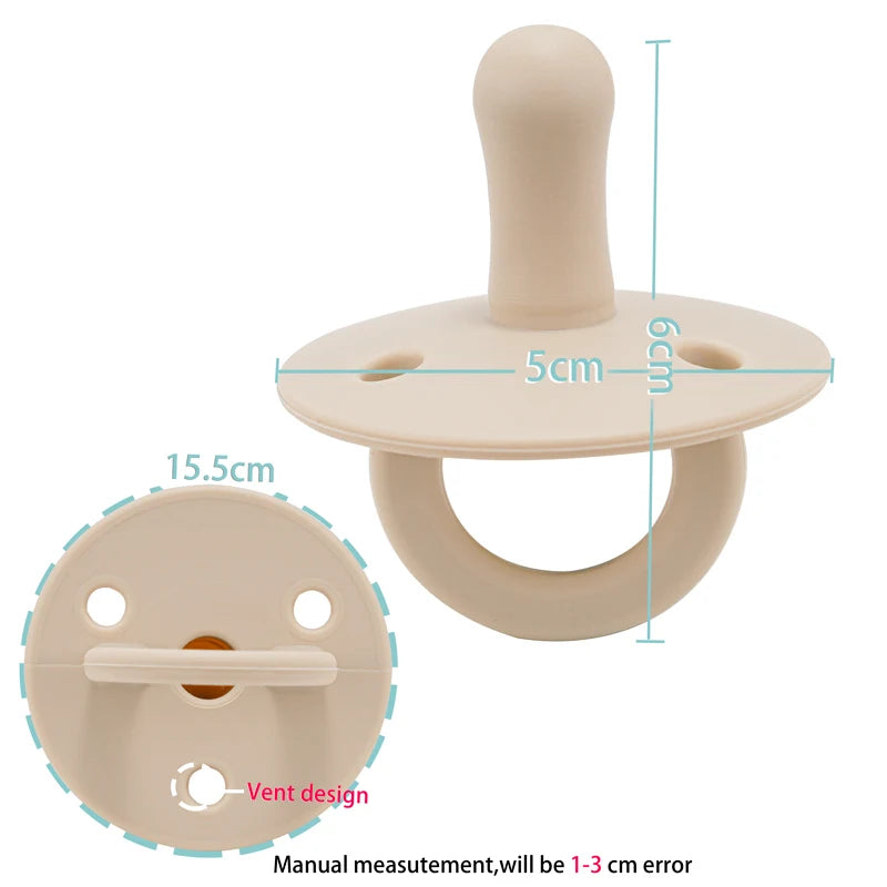 A beige silicone baby pacifier soother with a rounded top and a ring base.