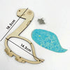 A wooden puzzle featuring a giraffe shape and a corresponding piece, demonstrating fine motor skills.