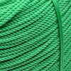 A close-up of a thick, bright green heavy-duty polyethylene rope coiled and bundled.