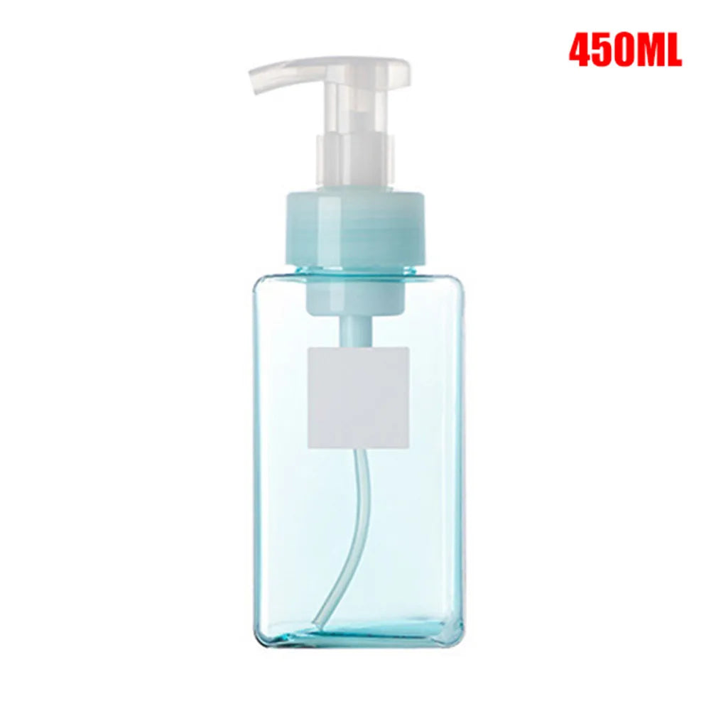 A clear plastic bottle with a light blue liquid and a white pump dispenser for manual foam soap.