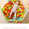 A colorful ocean-themed soft play pit filled with round balls in various bright colors for toddlers.