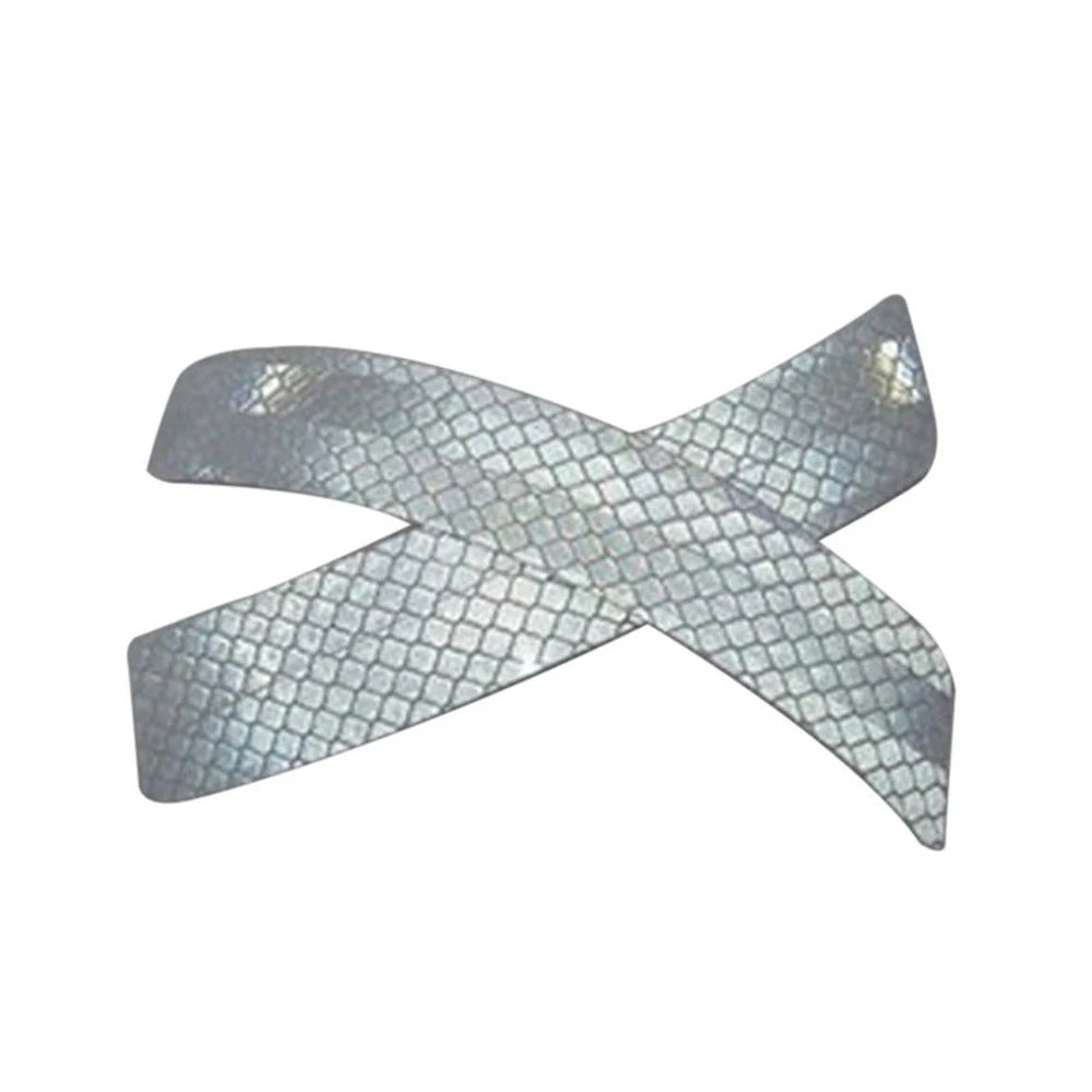 A set of two reflective safety stickers shaped like an 'X' for car fenders.