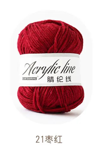 A ball of deep red acrylic yarn labeled Acrylic line for knitting and crochet