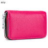 A vibrant pink genuine leather card holder with a zipper closure and RFID protection feature.