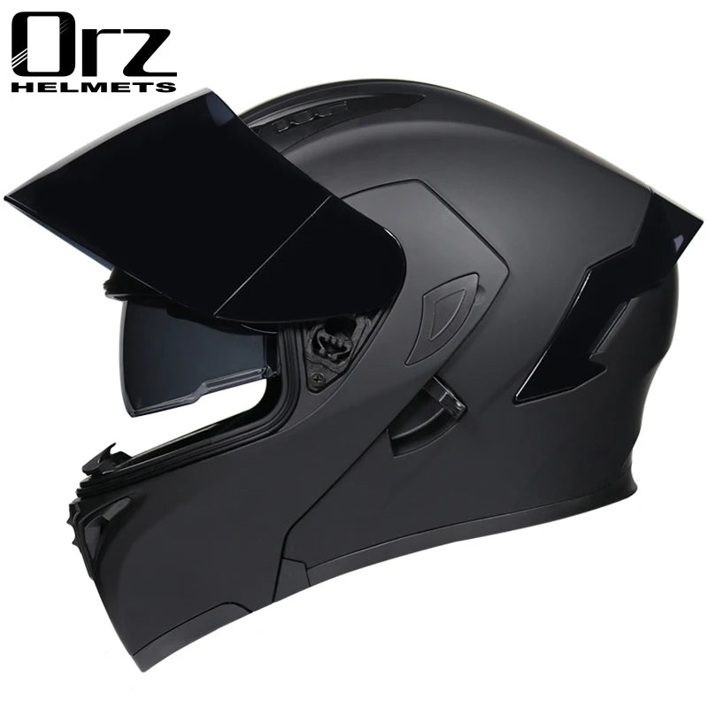 A black DOT-approved modular flip-up motorcycle helmet shown from the side.