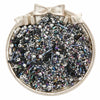 A small, ornate silver container filled with a variety of mixed glass seed beads in various colors and sizes.