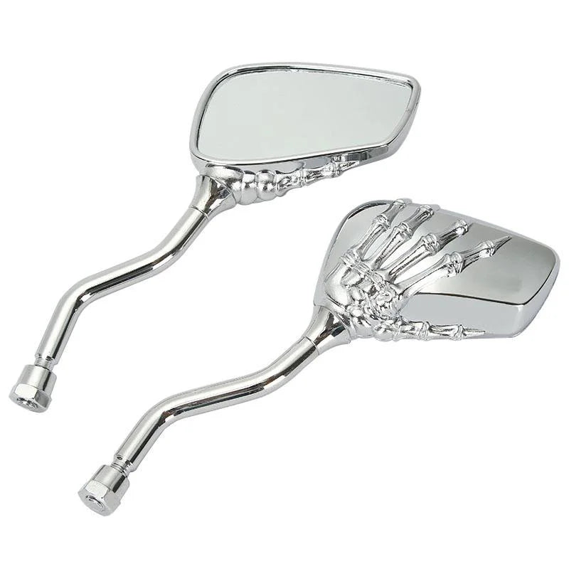 A set of two chrome universal skull hand motorcycle side mirrors.