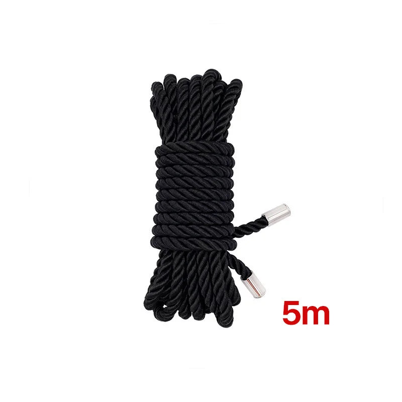 Black soft silk bondage rope coiled and displayed with a 5-meter measurement marker.