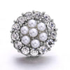 Silver metal snap buttons for jewelry making, featuring a cluster design of round and faceted stones.