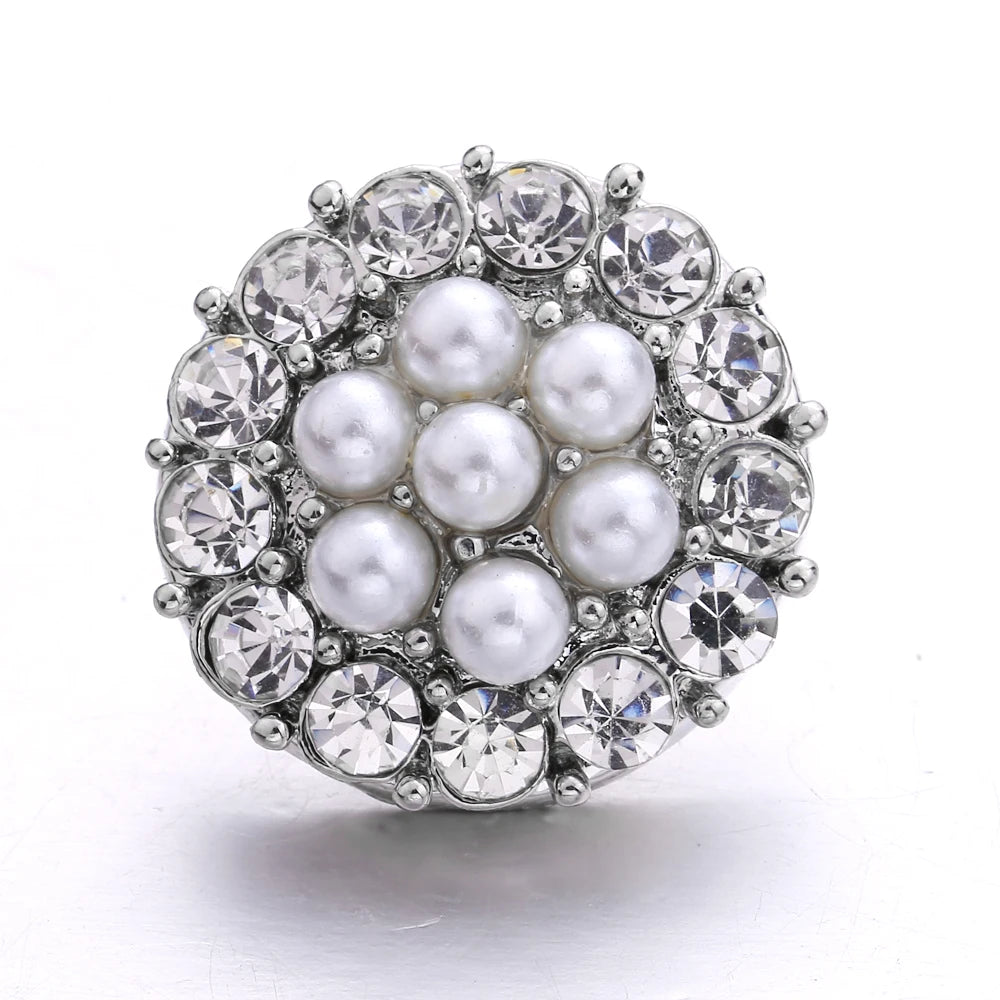 Silver metal snap buttons for jewelry making, featuring a cluster design of round and faceted stones.