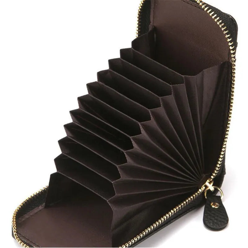 A dark brown genuine leather RFID-blocking card holder wallet with a zippered closure.