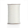 A spool of white waxed cotton cord used for jewelry making.