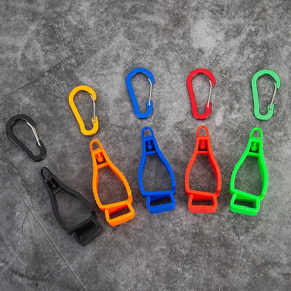 A collection of colorful durable glove clips in various shapes and sizes displayed on a gray surface.
