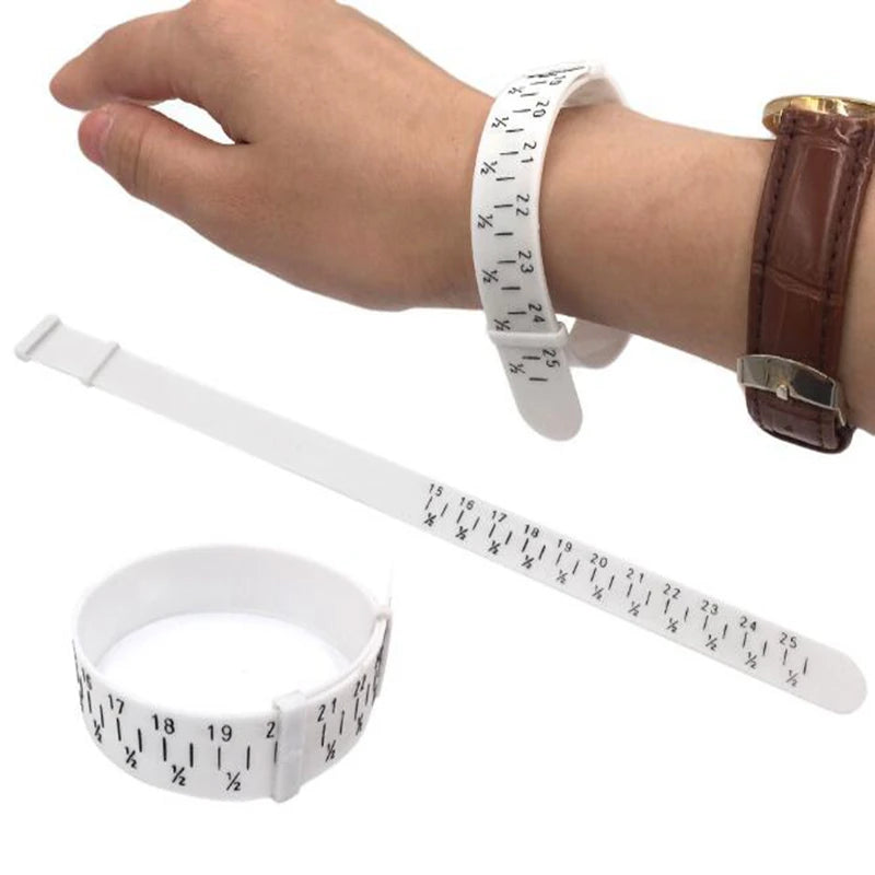 A hand is wearing a white measuring bracelet and a brown leather bracelet, with a separate white measuring tape shown below.