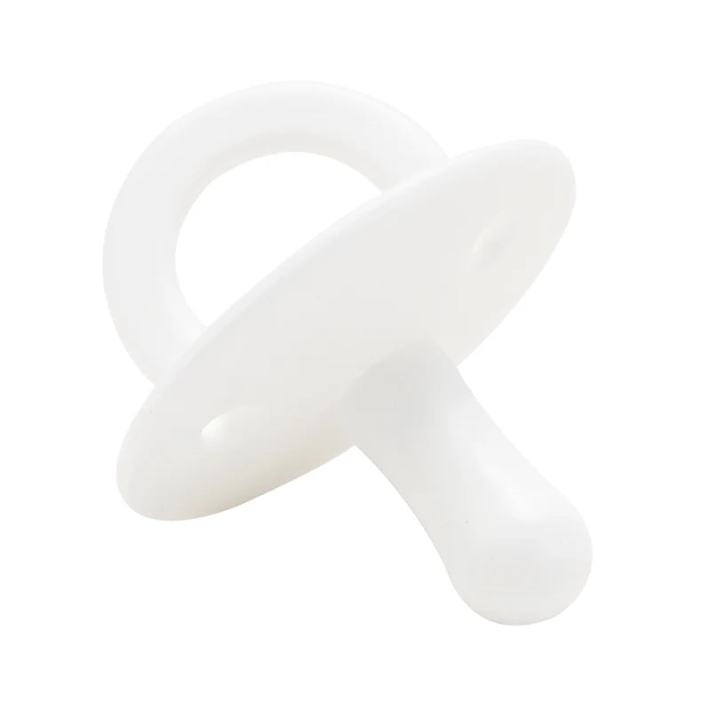 A white silicone baby pacifier soother with a ring and a nipple.