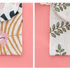 Two views of a white fabric cosmetic storage pouch with floral and leaf print patterns on a pink background.