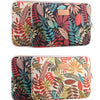 A pair of patterned canvas laptop sleeves featuring tropical leaves and floral designs.