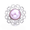 Silver metal snap buttons with a round pinkish pearl center for jewelry making